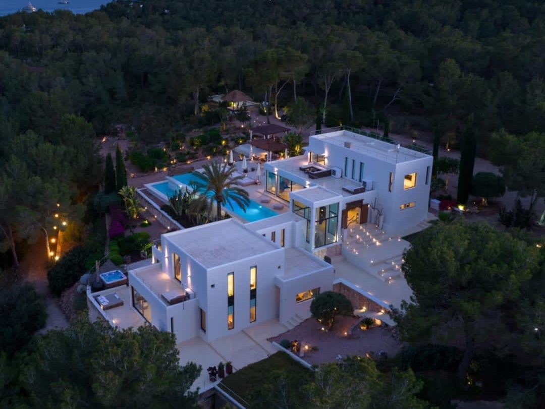Group travel guests enjoying a luxury Ibiza villa setting