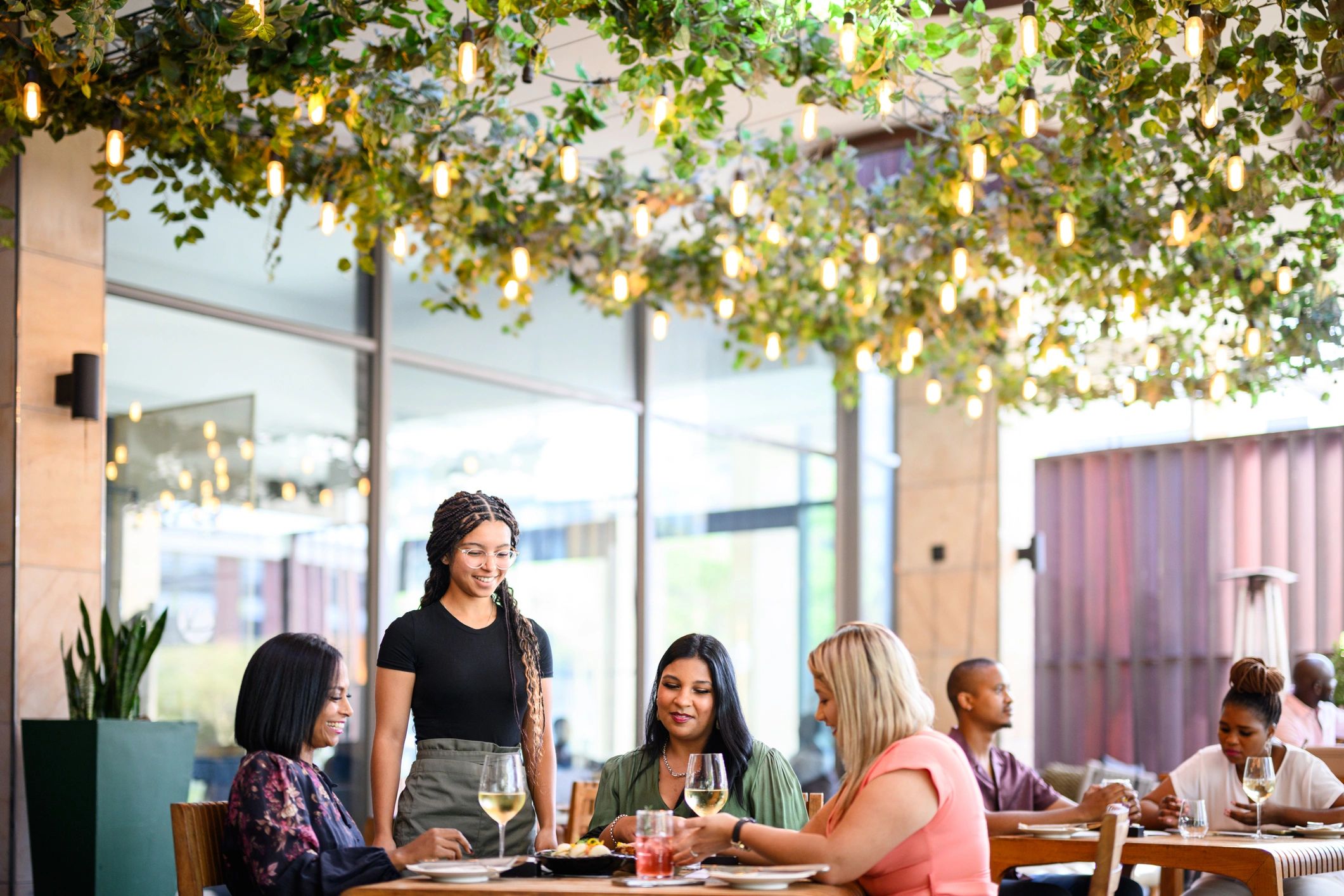 Group enjoying a wine tasting experience on an outdoor terrace
